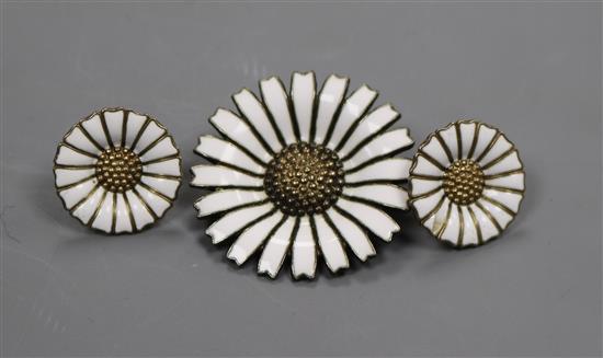 A Danish sterling silver flower brooch and a pair of unmarked similar earrings.